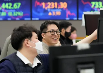Asian shares surge after Wall St. gains