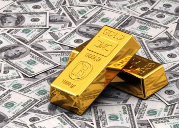 Gold slips as dollar jumps ahead of Fed’s decision on interest rates