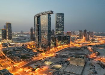 a city with a lot of tall buildings at night